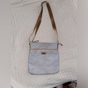 Tommy Hilfiger gray shoulder bag, with a brown adjustable strap.